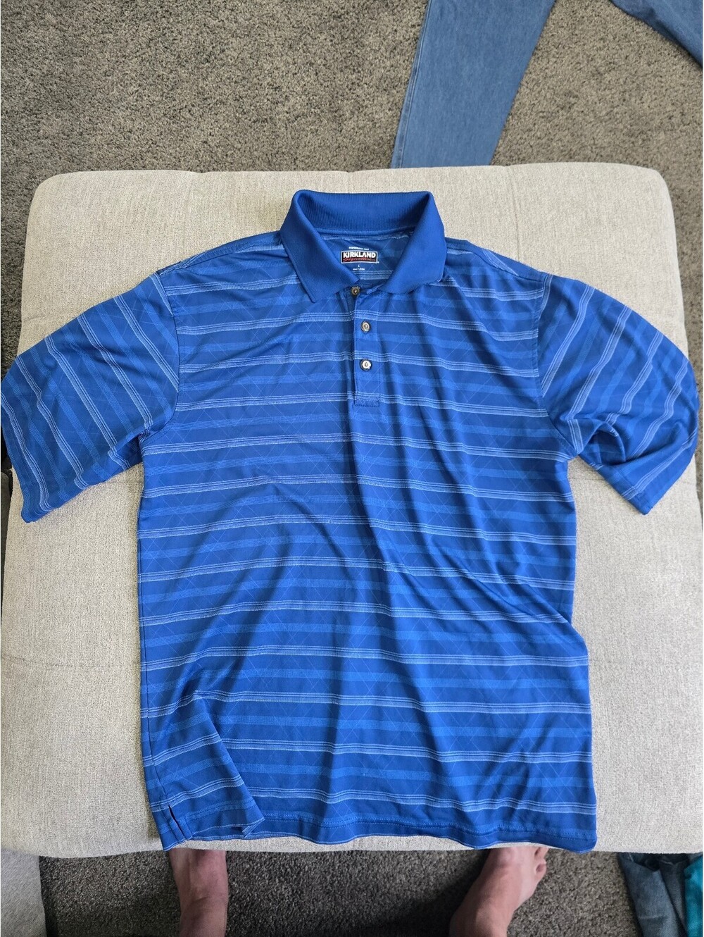 Kirkland Signature blue striped performance polo shirt